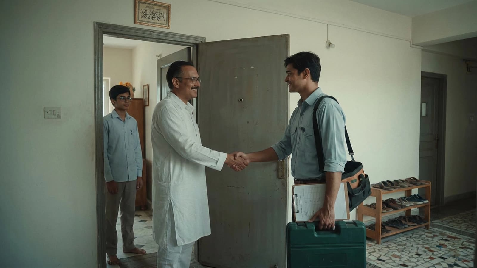 A Kaajly specialist and customer shaking hands after a completed job in a Dhaka home